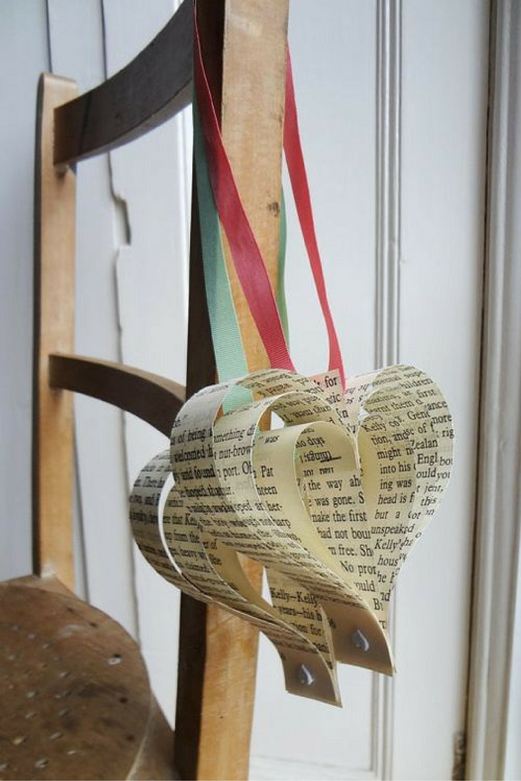 paper hearts made from sheet music sheets - wedding pew decoration